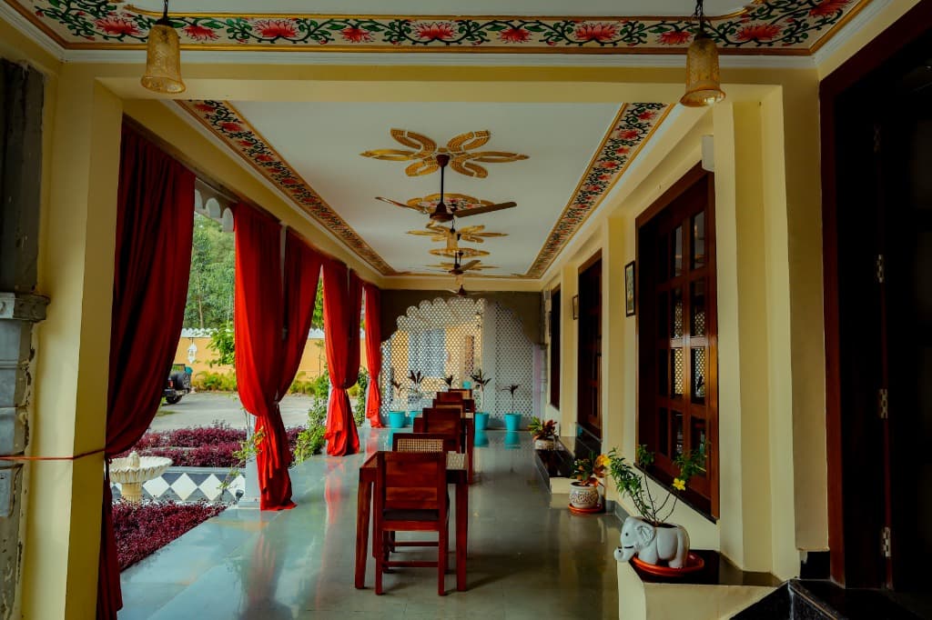 Painted ceiling veranda hallway with courtyard views