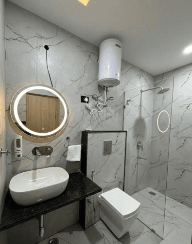 Executive Room modern marble bathroom with LED mirror