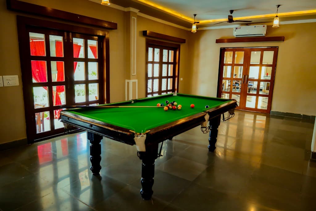 Full-sized green billiards snooker table in the heritage game room